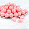 front view of a pile of 20mm Cotton Candy  Pink Solid AB Bubblegum Beads