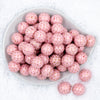 Top view of a pile of 20mm Pink with Gold Arrows Print Chunky Bubblegum Beads