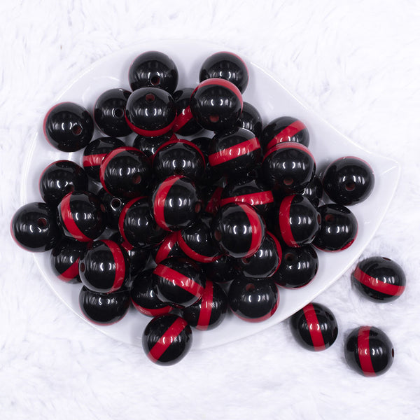 top view of a pile of 20mm Red Band on Black Bubblegum Beads