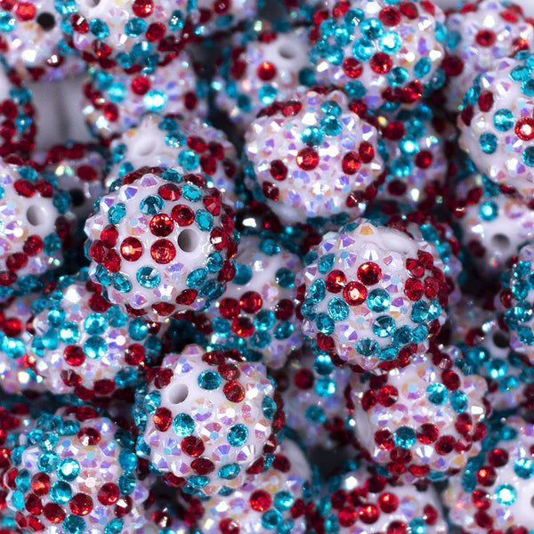 Close up view of a pile of 20mm Red, Teal and White Confetti Rhinestone AB Bubblegum Beads
