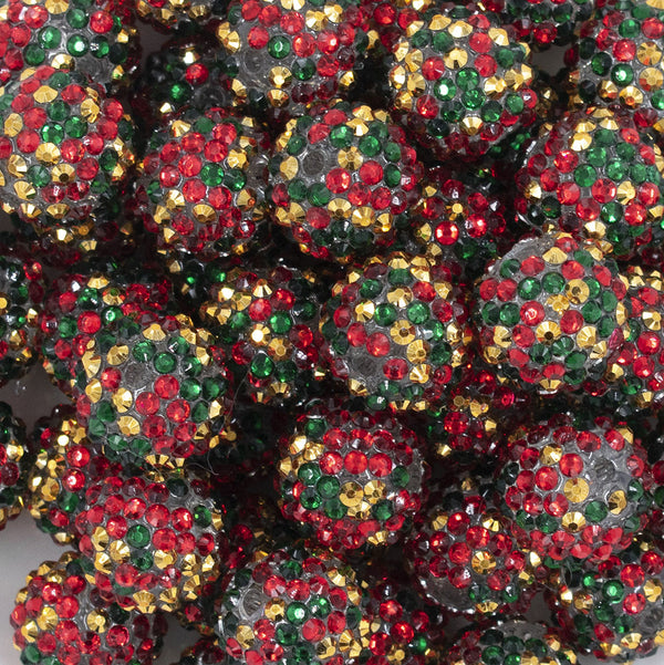 Close up view of a pile of 20mm Red, Green & Gold Confetti Rhinestone AB Bubblegum Beads