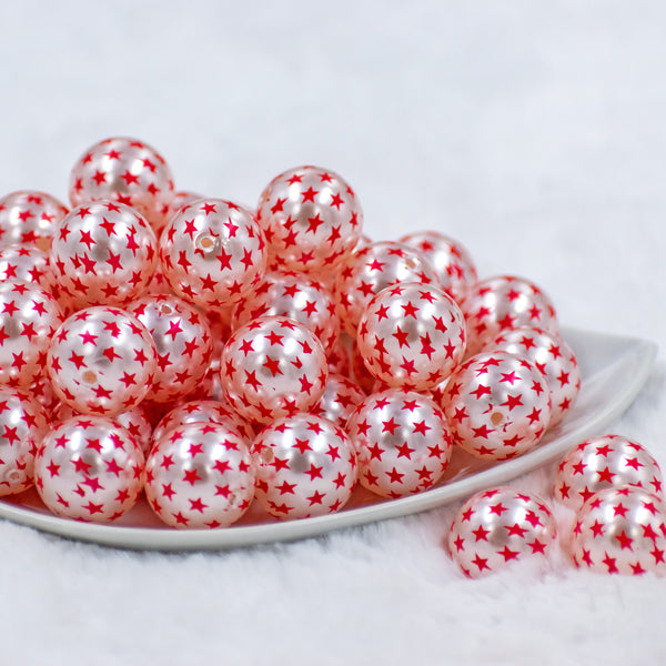 front view of a pile of 20mm Silver Pearl with Red Stars Acrylic Bubblegum Beads