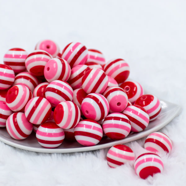 front view of a pile of 20mm Red, Pink & White Stripe Bubblegum Beads