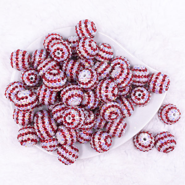 Top view of a pile of 20mm Red & White Striped Rhinestone AB Bubblegum Beads