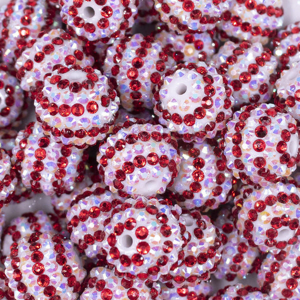 Close up view of a pile of 20mm Red & White Striped Rhinestone AB Bubblegum Beads