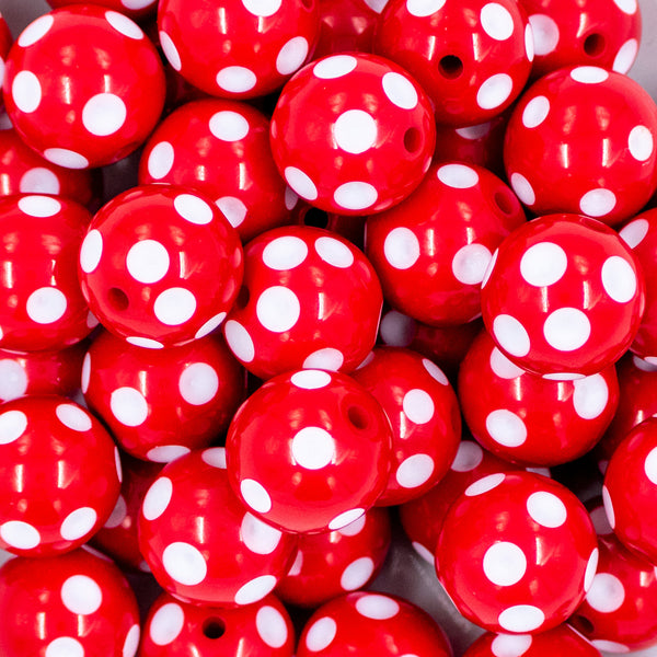 Close up view of a pile of 20mm Red with White Polka Dots Acrylic Bubblegum Beads