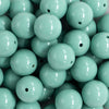 Close up view of a pile of 20mm Robin Blue Solid Bubblegum Beads