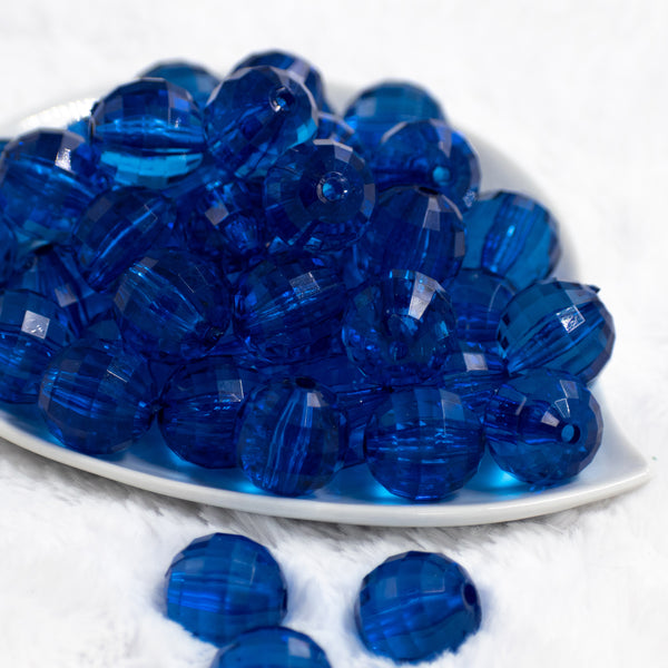 Front view of a pile of 20mm Royal Blue Transparent Disco Faceted Pearl Bubblegum Beads
