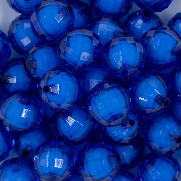 Close up view of a pile of 20mm Royal Blue Translucent Faceted Bead in a bead, chunky acrylic bubblegum Beads