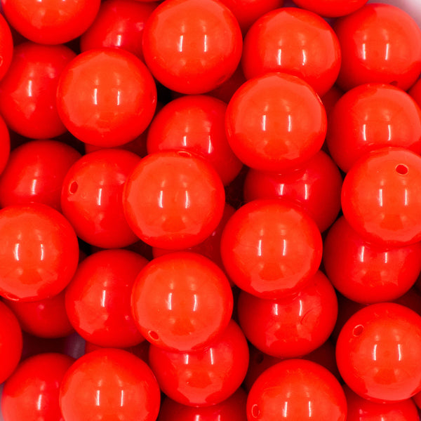 Close up view of a pile of 20mm Safety Orange Solid Acrylic Chunky Bubblegum Beads