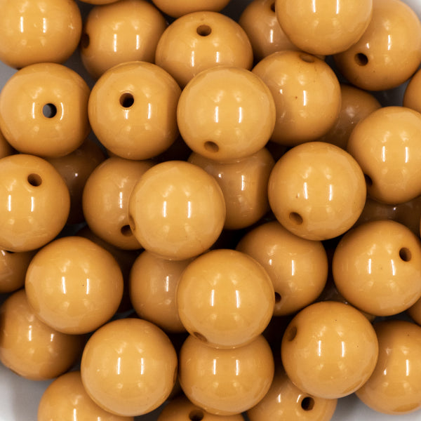 close up view of a pile of 20mm Sandstone Brown Solid Bubblegum Beads