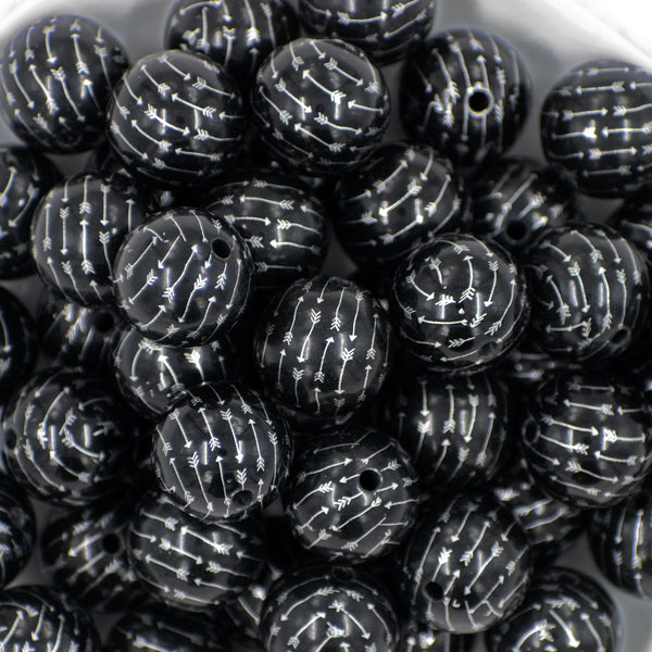 close-up of 20mm Black with Silver Arrows  Print Chunky Acrylic Bubblegum Beads in a white dish