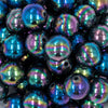 Close up view of a pile of 20mm Smoked Neochrome Black Solid AB Bubblegum Beads