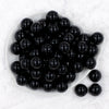 top view of a dish containing a pile of 20mm solid black Chunky Bubblegum Beads