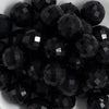 close up view of a pile of 20mm Black Solid Disco Faceted Bubblegum Beads