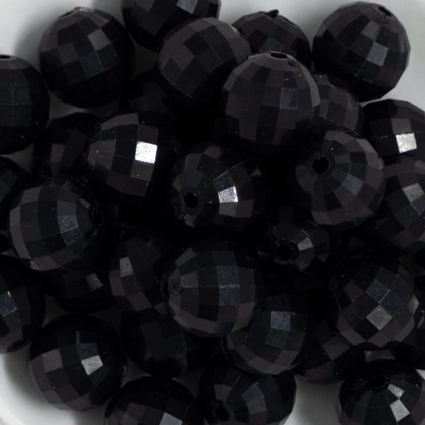 close up view of a pile of 20mm Black Solid Disco Faceted Bubblegum Beads