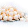 front of a pile of 20mm Off White Solid Bubblegum Beads