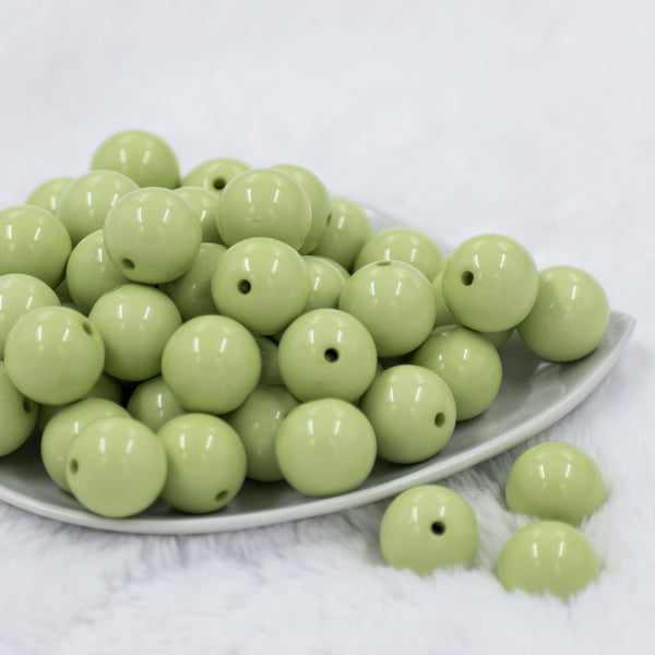 Front view of a pile of 20mm Key Lime Green Solid Chunky Acrylic Bubblegum Beads