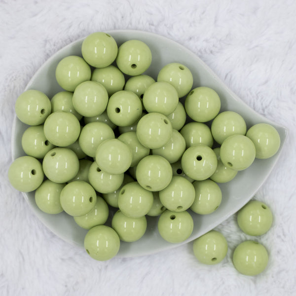 Top view of a pile of 20mm Key Lime Green Solid Chunky Acrylic Bubblegum Beads