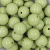 Close up view of a pile of 20mm Key Lime Green Solid Chunky Acrylic Bubblegum Beads