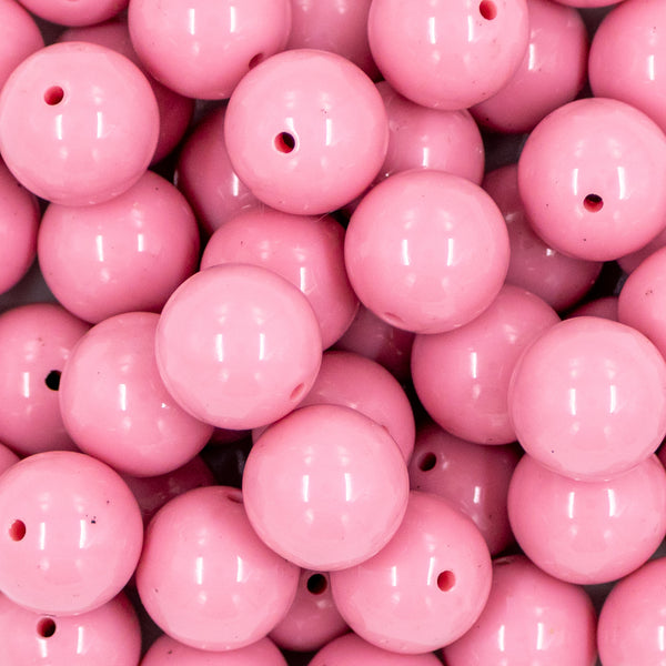 Close up view of a pile of. 20mm Mauve Pink Solid Chunky Acrylic Bubblegum Beads