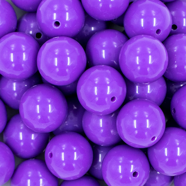 Close up view of a pile of 20mm Passion Purple Solid Chunky Acrylic Bubblegum Beads