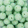close up view of a pile of 20mm Spearmint Green Rhinestone AB Bubblegum Beads