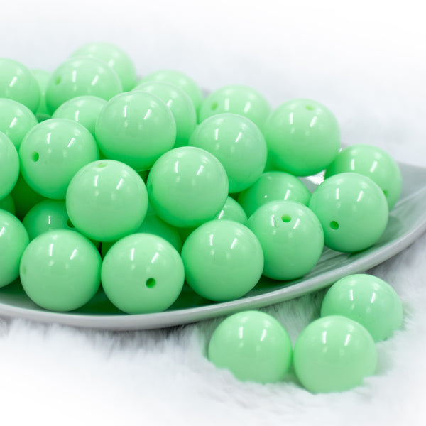 front view of a pile of 20mm Spearmint Green Solid Chunky Bubblegum Beads