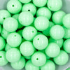 close-up view of a pile of 20mm Spearmint Green Solid Chunky Bubblegum Beads