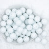 top view of a stack of 20mm Bright White Solid Chunky Bubblegum Beads in a white dish