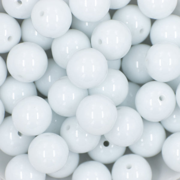close-up view of a stack of 20mm Bright White Solid Chunky Bubblegum Beads in a white dish