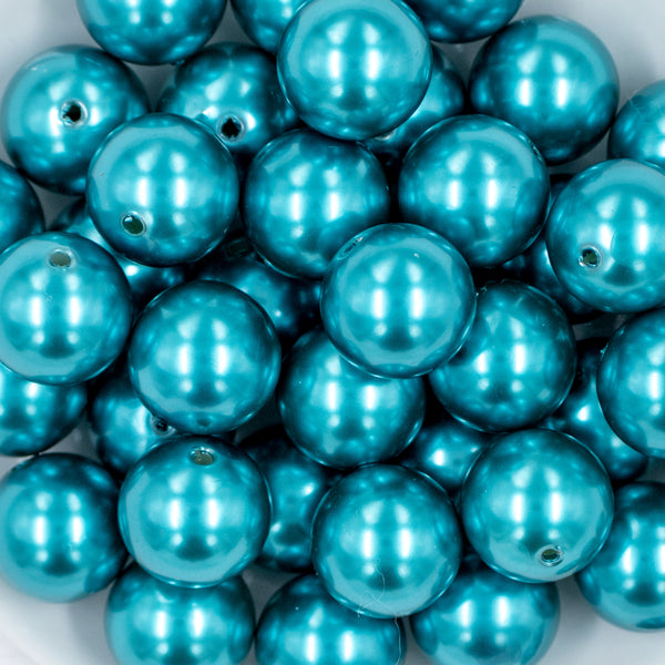 close-up view of a pile of 20mm Teal Blue Faux Pearl Chunky Acrylic Bubblegum Beads