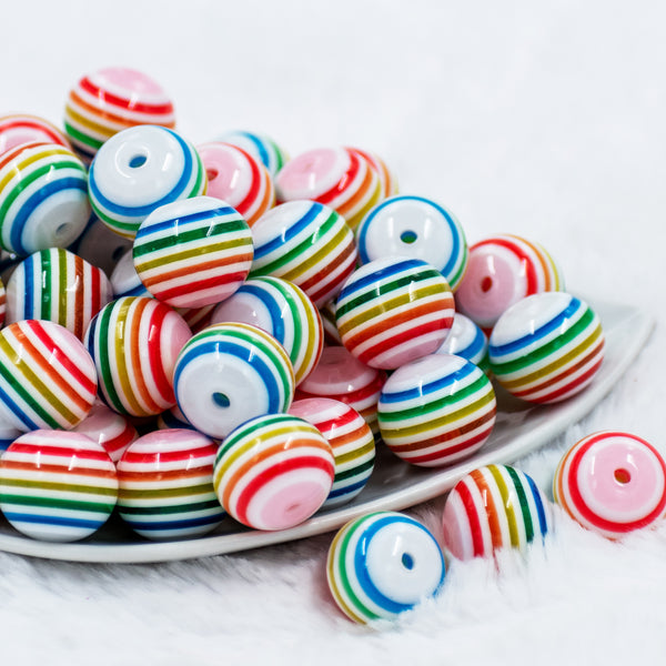 front view of a pile of 20mm Thin Rainbow and White Striped Bubblegum Beads