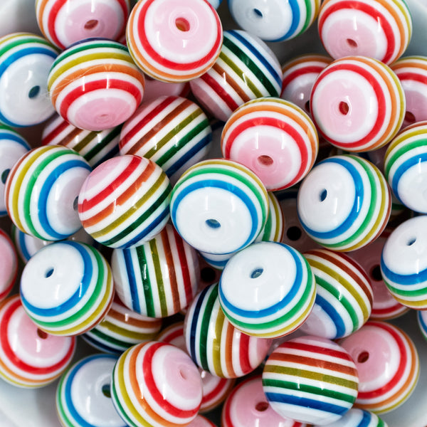 close up of a pile of 20mm Thin Rainbow and White Striped Bubblegum Beads