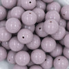 Close up view of a pile of 20mm Thistle Purple Solid Acrylic Chunky Bubblegum Beads