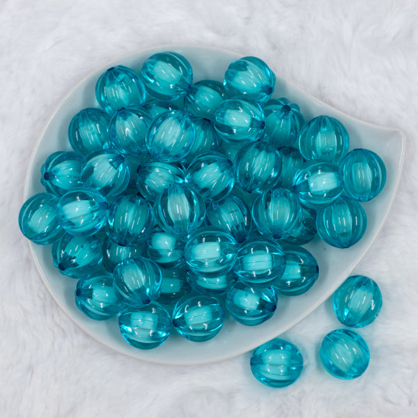 Top view of a pile of 20mm Sky Blue Transparent Pumpkin Shaped Bubblegum Beads