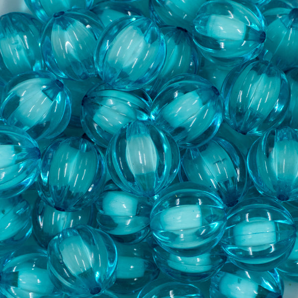 Close up view of a pile of 20mm Sky Blue Transparent Pumpkin Shaped Bubblegum Beads