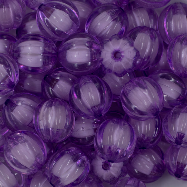 Close up view of a pile of 20mm Purple Transparent Pumpkin Shaped Bubblegum Beads