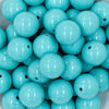 close-up view of a pile of 20mm Turquoise Blue Solid Chunky Bubblegum Beads