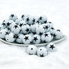 front view of a a pile of 20mm White with Black Stars Chunky Bubblegum Beads