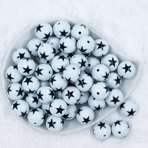 top view of a a pile of 20mm White with Black Stars Chunky Bubblegum Beads
