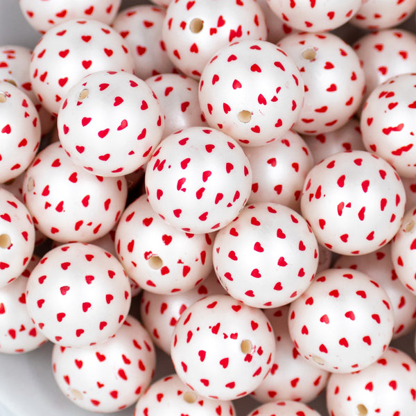 close-up view of a pile of 20mm White with Red Hearts Chunky Acrylic Bubblegum Beads