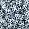 Close up view of a pile of 20mm Black & White Paw Print Acrylic Chunky Bubblegum Beads