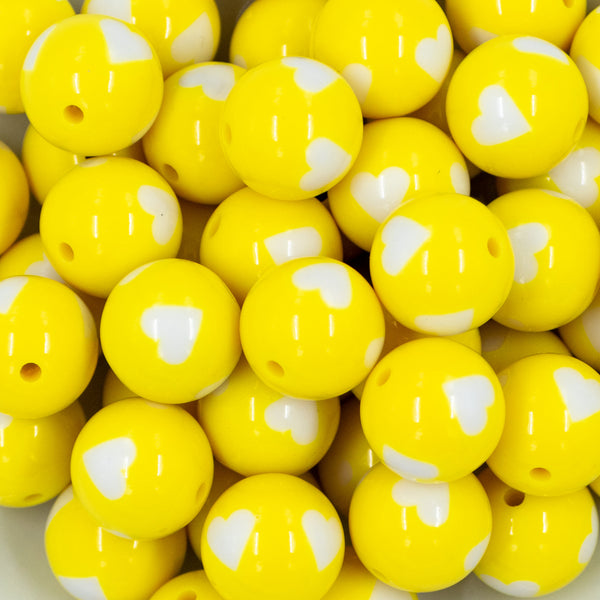 close-up view of a pile of 20mm Yellow Hearts Chunky Acrylic Bubblegum Beads