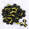 top view of a pile of 20mm Yellow Band on Black Bubblegum Beads