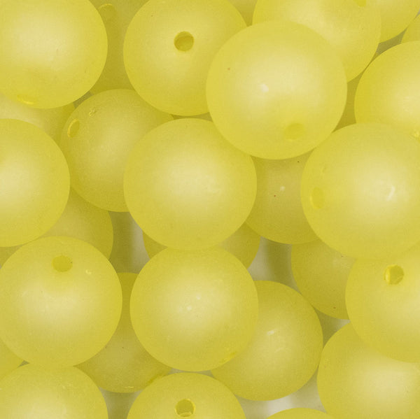 Close up view of a pile of 20mm yellow frosted bubblegum beads