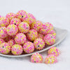 front view of a pile of 20mm Yellow & Pink Confetti Rhinestone AB Bubblegum Beads