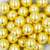 close-up view of a pile of 20mm Yellow Faux Pearl Chunky Acrylic Bubblegum Beads