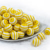 front view of a pile of 20mm Yellow with White Stripes Chunky Bubblegum Beads