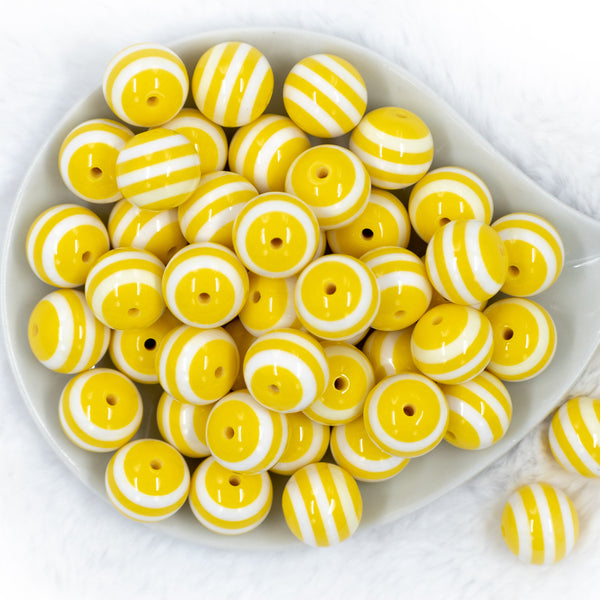 top view of a pile of 20mm Yellow with White Stripes Chunky Bubblegum Beads
